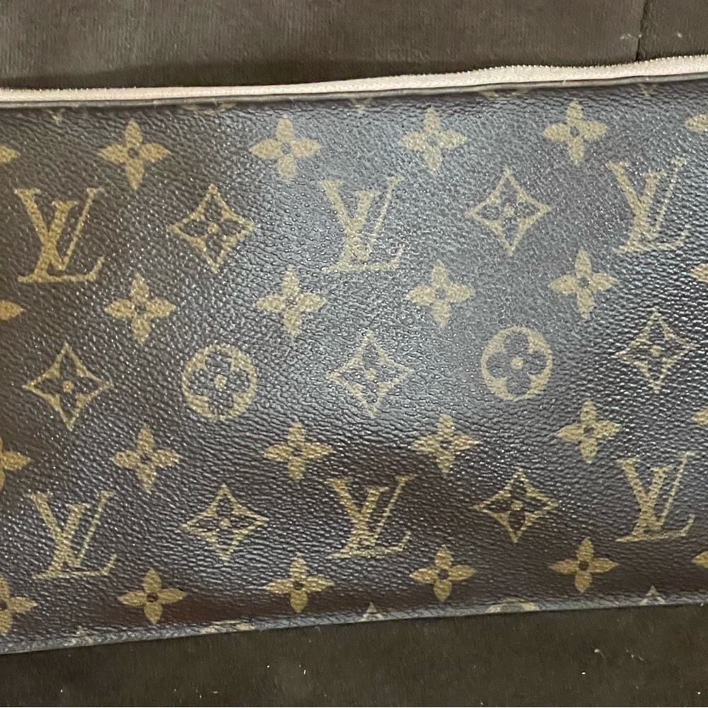Louis Vuitton Brown Monogram clutch/wristlet
9x6 
I have been the only owner